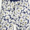 Curved-jeans i denim med blommönster